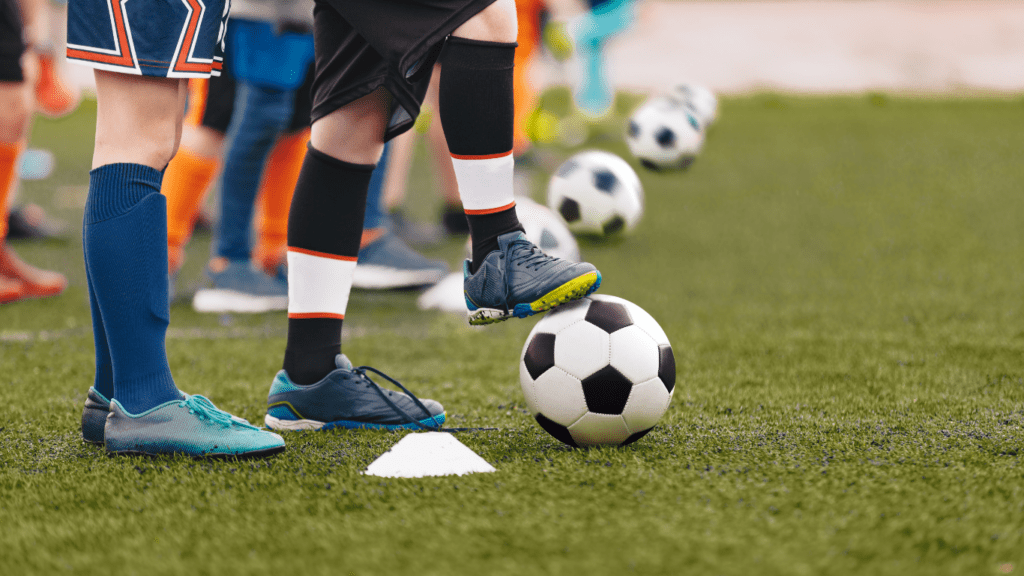 a group of people playing soccer on a field