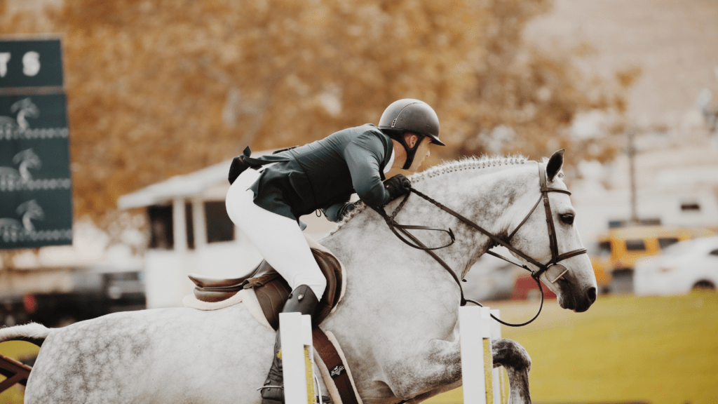 a jockey on a horse racing down the track