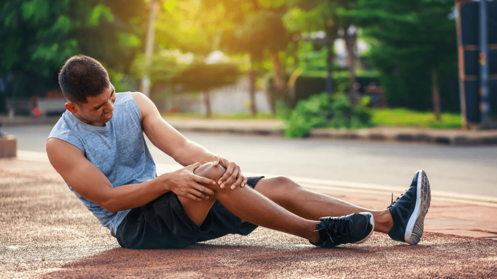 a person holding his knee