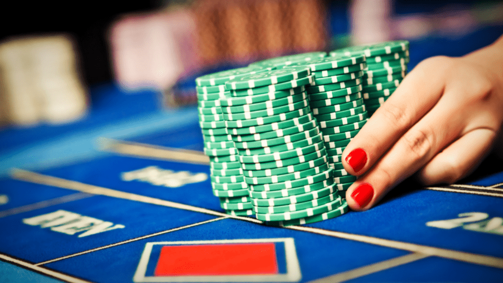 an image of a casino table with chips and roulettes