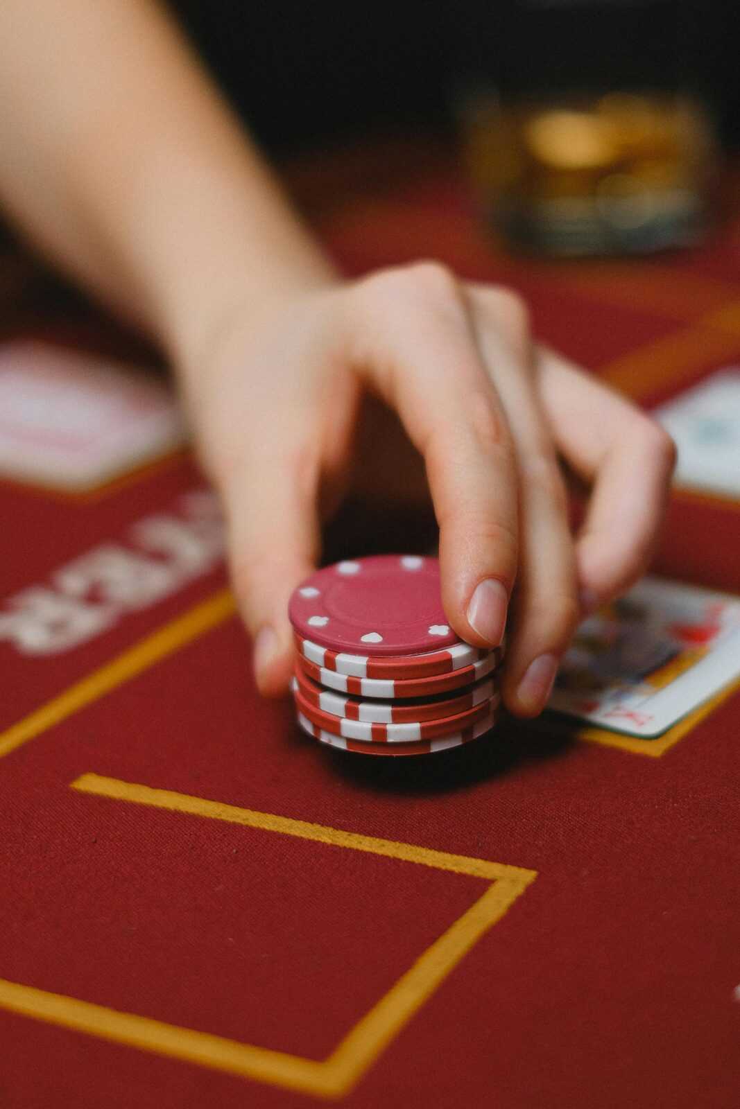 A Person Holding Poker Chips